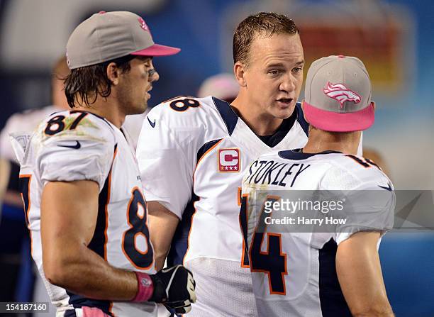 Peyton Manning of the Denver Broncos talks with Brandon Stokley and Eric Decker during a 35-24 win over the San Diego Chargers at Qualcomm Stadium on...