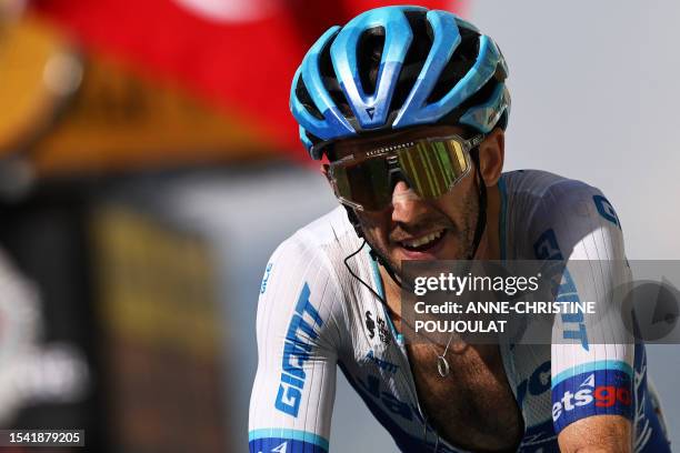 Team Jayco Alula's British rider Simon Yates cycles to the finish line of the 17th stage of the 110th edition of the Tour de France cycling race, 166...