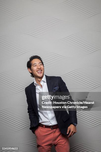 Charlie Chanaratsopon, who owns the Charming Charlie accessory chain, poses for a portrait at his home, Monday, Nov. 19 in Houston.