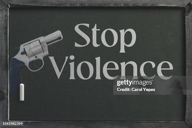 handgun and stop violence message - school chair covers stock pictures, royalty-free photos & images