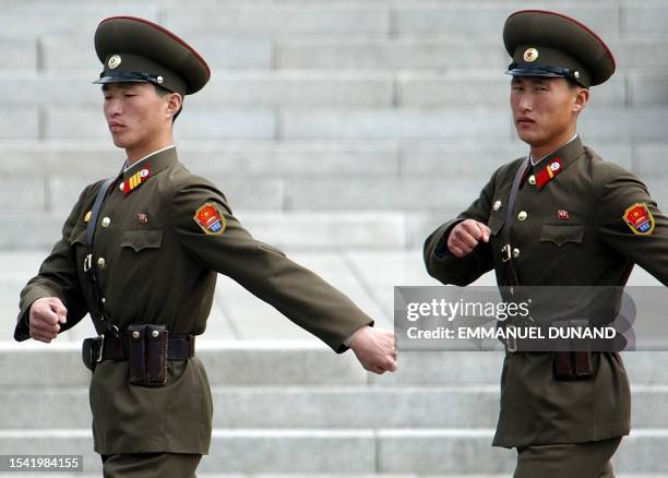 Two North Korean soldiers march, 09 April 2003 at Panmunjom peace village inside the demilitarized zone between North and South Korea. The UN...