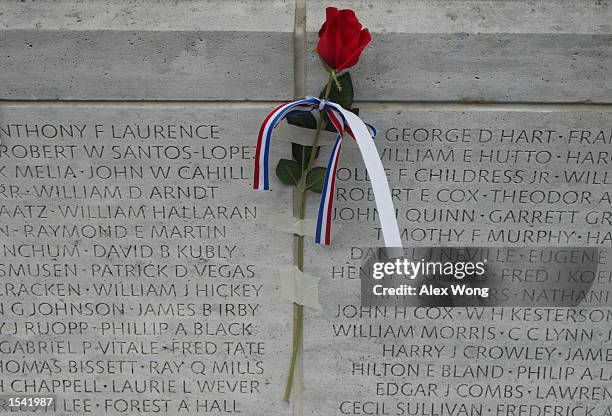 Red rose is placed at the National Law Enforcement Officers Memorial May 13, 2002 in Washington, DC. Thousands gather on the site of the National Law...
