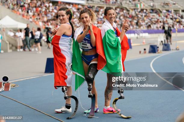 Ambra Sabatini, Martina Caironi and Monica Graziana Contrafatto of team Italy cereblate after the Women's 400m T63 during day six of the Para...