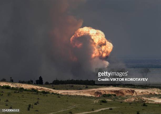 Picture shows detonation of ammunition caused by a fire at a military training field in the Kirovsky district of Crimea on July 19, 2023. Russian...