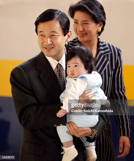 Japanese Crown Prince Naruhito, Crown Princess Masako and their daughter Aiko arrive at Tokyo station after a week-long vacation May 14, 2002 in...