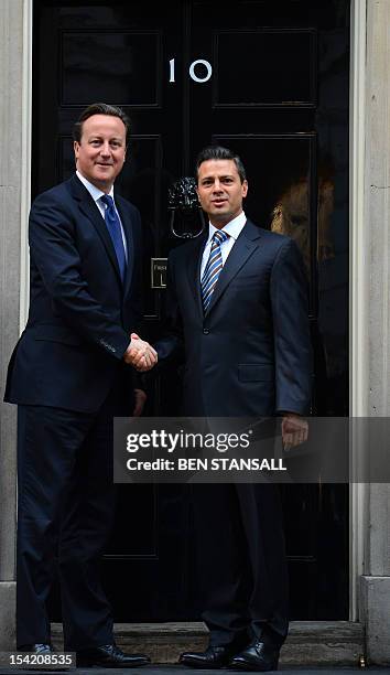 British Prime Minister David Cameron greets Mexican president-elect Enrique Pena Nieto outside 10 Downing Street in London on October 16, 2012. Pena...