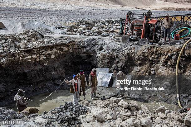 Indian labourers from Indian states of Bihar and Jharia work on the road leading to the Pangong Lake which leads to the border of China on October 5,...