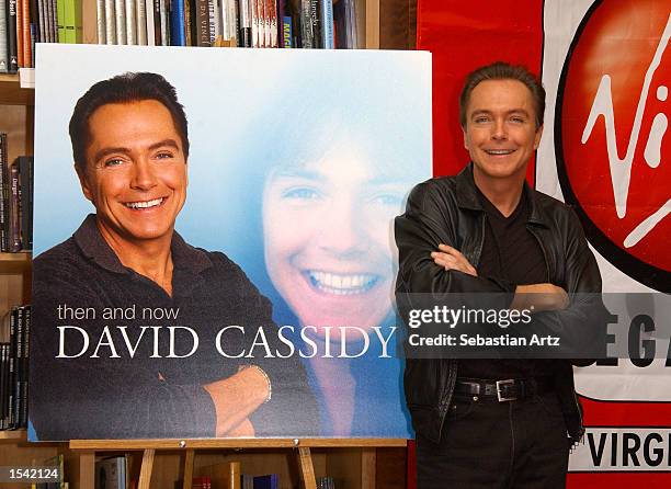 Singer David Cassidy poses during an in-store appearance to promote his new release "Then and Now" at Virgin Megastore May 15, 2002 in Los Angeles,...