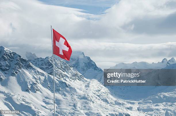 swiss flag in the engadin - swiss flag bildbanksfoton och bilder