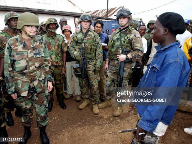 Military attache in Liberia, Colonel Sue Ann Sandusky accompanied by US soliders and soldiers of the ECOMIL , the West African peacekeeping force in...