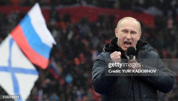 Russian Presidential candidate, Prime Minister Vladimir Putin delivers a speech during a rally of his supporters at the Luzhniki stadium in Moscow on...
