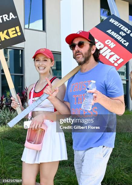 Greer Grammer walks with a member of SAG-AFTRA and the WGA the picket line in support of the SAG-AFTRA and WGA strike at Netlfix on July 19, 2023 in...