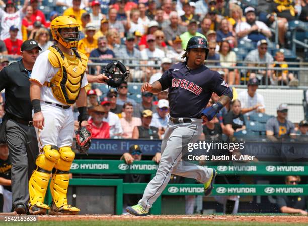 Jose Ramirez of the Cleveland Guardians scores on a bunt single in the fourth inning against the Pittsburgh Pirates during inter-league play at PNC...