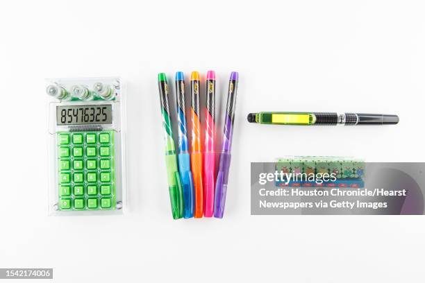 Hydro powered calculator, frog a day eraser set, Post-it highlighter and Bic pens, photographed in the Studio,Tuesday, Aug. 6 in Pasadena.