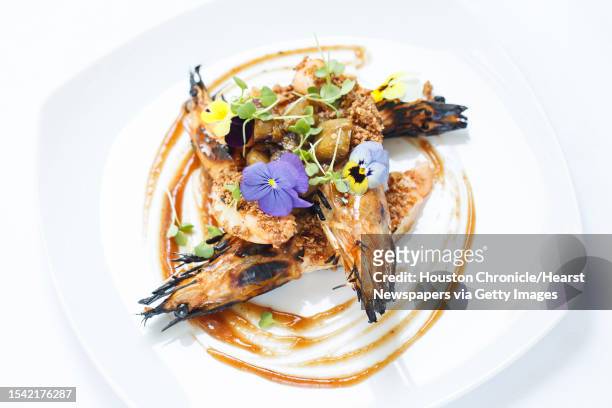 The Grilled Prawns with Smoked Eggplant, Roast Hazelnuts and Membrillo at Restaurant CINQ inside La Colombe d'Or Hotel, Tuesday, Aug. 13 in Houston.