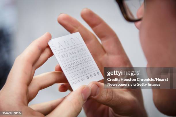 Travis Smith checks registration on a business card at Spindletop Design and Workhorse Printmakers, Wednesday, Aug. 28 in Houston. Jennifer Blanco,...