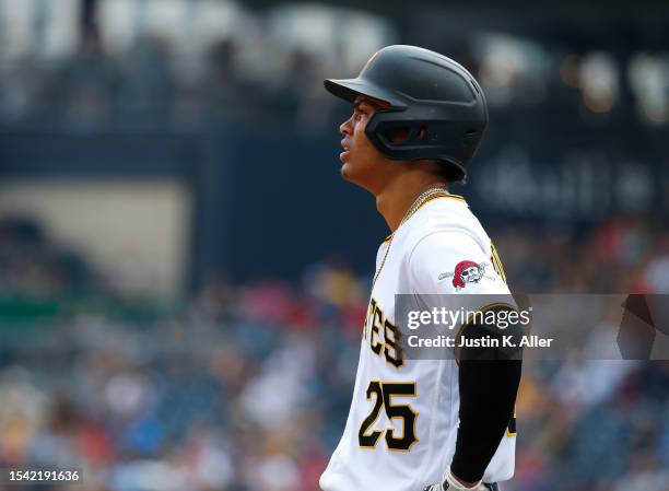 Endy Rodriguez of the Pittsburgh Pirates stands on base after his first Major League hit in the seventh inning against the Cleveland Guardians during...