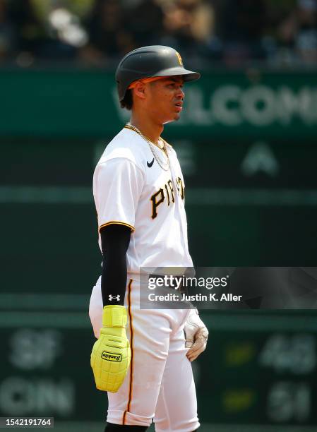 Endy Rodriguez of the Pittsburgh Pirates stands on base after his first Major League hit in the seventh inning against the Cleveland Guardians during...