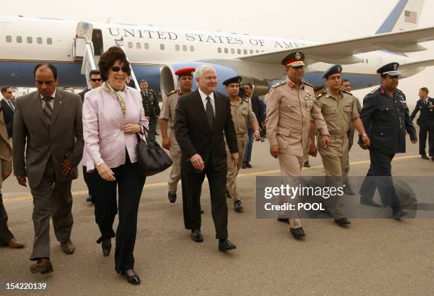 Defence Secretary Robert Gates walks with US ambassador to Egypt Margaret Scobey , Egypt's Major General Hassan el-Roweini and other Egyptian...