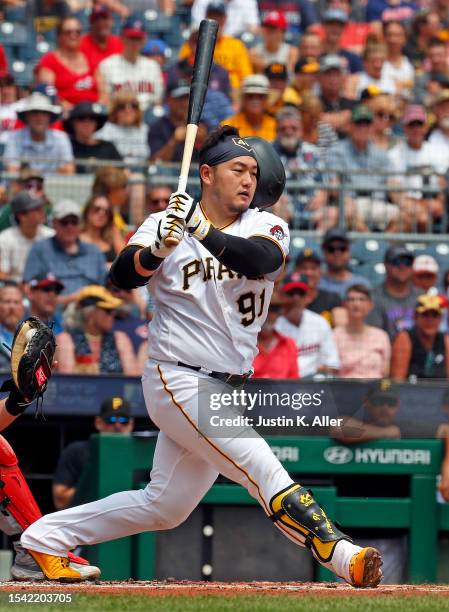 Ji Man Choi of the Pittsburgh Pirates swings out of his helmet in the second inning against the Cleveland Guardians during inter-league play at PNC...