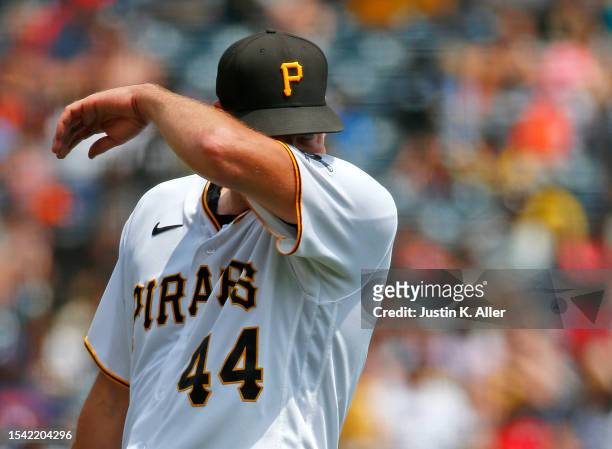 Rich Hill of the Pittsburgh Pirates reacts in the fifth inning after giving up three runs on three hits against the Cleveland Guardians during...