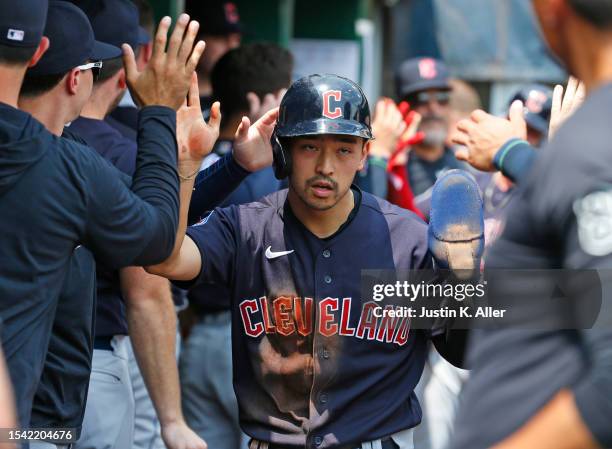 Steven Kwan of the Cleveland Guardians celebrates after scoring on a two RBI double in the fifth inning against the Pittsburgh Pirates during...