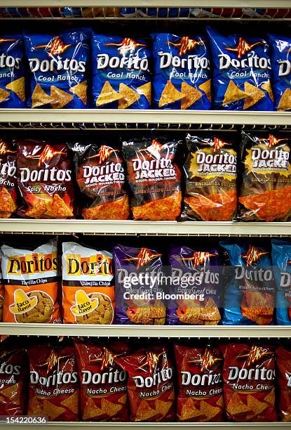 Various flavors of PepsiCo Inc. Doritos brand snack chips sit on display in a supermarket in Princeton, Illinois, U.S., on Friday, Oct. 12, 2012....