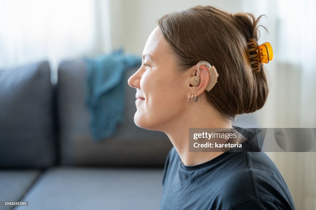 Portrait of woman with hearing aid