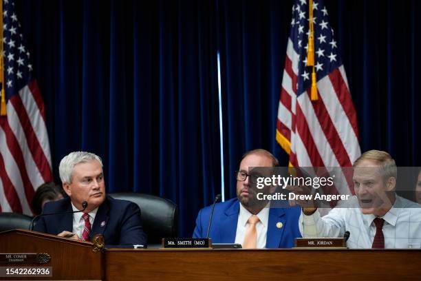 Committee chairman Rep. James Comer and Rep. Jason Smith look on as Rep. Jim Jordan questions witnesses during a House Oversight Committee hearing...