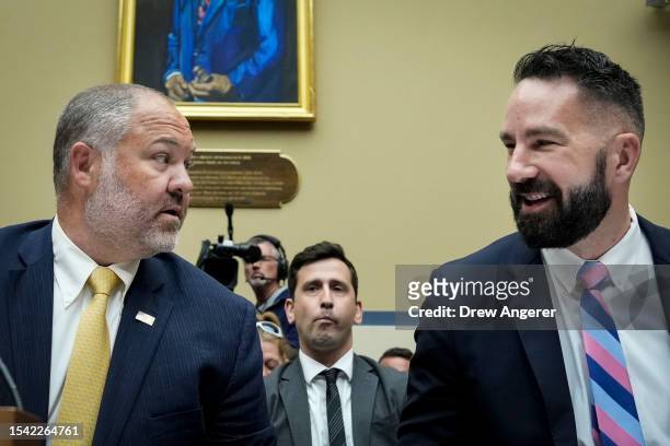 Supervisory IRS Special Agent Gary Shapley and IRS Criminal Investigator Joseph Ziegler talk with each other as they arrive for a House Oversight...
