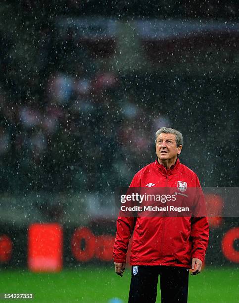 England manager Roy Hodgson looks on during the rain before the FIFA 2014 World Cup Qualifier between Poland and England at the National Stadium on...