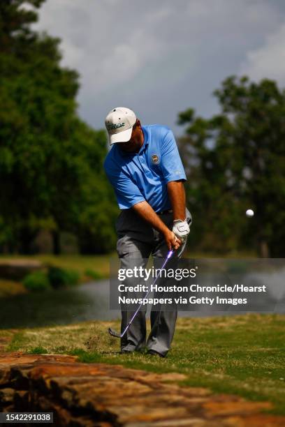 Danny Crowley, a professional golf teacher at Memorial Park Golf Course, demonstrates the use of a wedge on the 15th hole Monday, March 23 in...