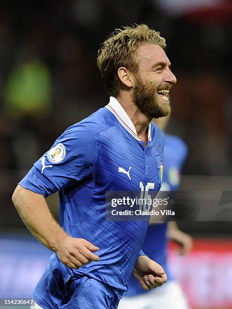 Daniele De Rossi of FC Italy celebrates scoring the second goal during the FIFA 2014 World Cup qualifier match between Italy and Denmark at Stadio...