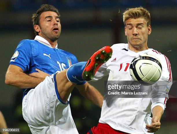Andrea Barzagli of Italy competes for the ball with Nicklas Bendtner of Denmark during the FIFA 2014 World Cup qualifier match between Italy and...