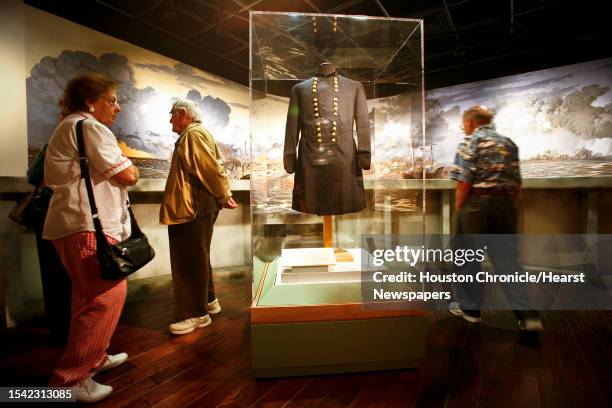 Members of the St. Elizabeth Ann Seton Catholic Church look at one of Ulysses S. Grant's uniforms on display at the new exhibit on Robert E. Lee and...