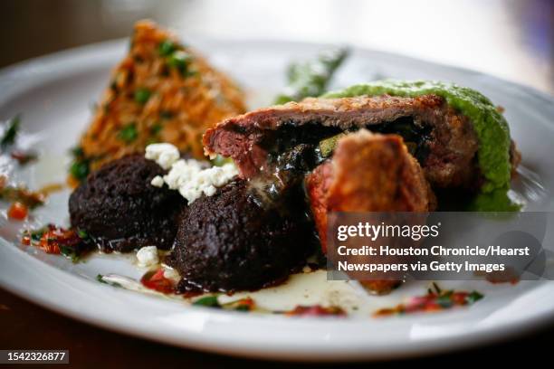 Hugo's restaurant Entree: Filete del Campesino made from tenderloin stuffed with squash, mushrooms, huitlacoche, and chihuahua cheese, topped with...