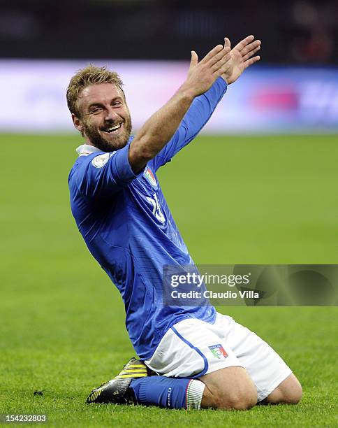 Daniele De Rossi of Italy celebrates scoring the second goal during the FIFA 2014 World Cup qualifier match between Italy and Denmark at Stadio...