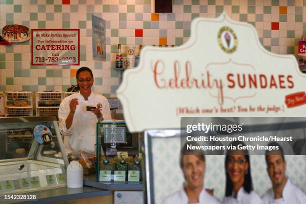 Bravo's Season 5 Top Chef Finalist, Carla Hall, takes a moment from mixing ice cream to enjoy some herself during her appearance at Marble Slab...