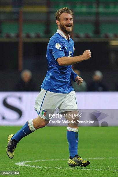 Daniele De Rossi of Italy celebrates a goal during the FIFA 2014 World Cup qualifier match between Italy and Denmark at Stadio Giuseppe Meazza on...