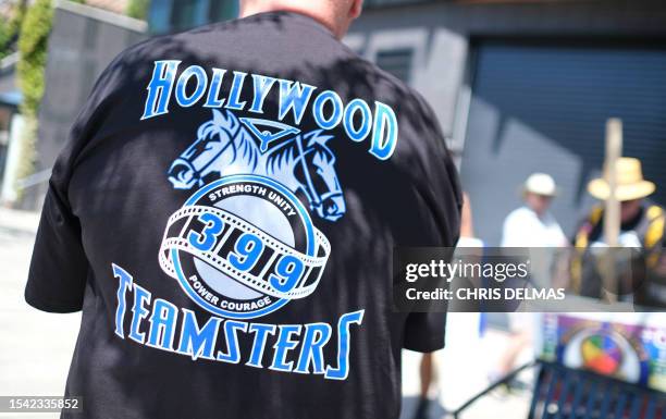 Teamsters Union members join members of the Writers Guild of America and the Screen Actors Guild on strike outside Amazon Studios in Culver City,...