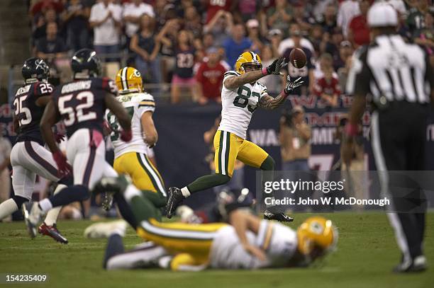 Green Bay Packers Tom Crabtree in action, making catch during touchdown reception vs Houston Texans at Reliant Stadium. Houston, TX CREDIT: John W....