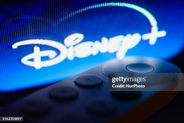 Disney+ logo on Chromecast menu displayed on a TV screen and Chromecast remote control are seen in this illustration photo taken in Krakow, Poland on...