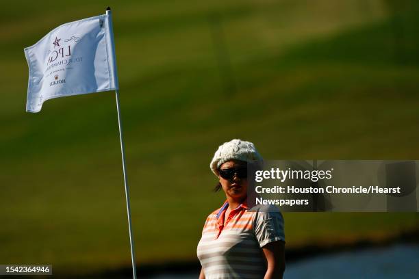 Golfer, Christina Kim, stands next to the pin during the opening day practice round of the 2009 LPGA Tour Championship at The Houstonian Golf &...