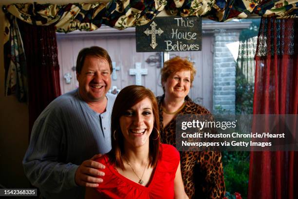 Carleton and Hazel Cole share a laugh with their adopted daughter, Kayla at their home Wednesday, Nov. 18 in Houston. The Cole's adopted Kayla at age...