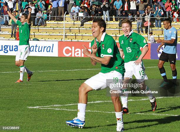 Carlos Saucedo of Bolivia celebrates a goal during a match between Uruguay and Bolivia as part of the South American Qualifiers for the FIFA Brazil...