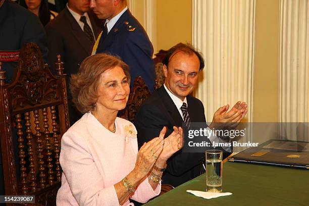 October 16: Queen Sofia of Spain and Spanish Secretary of State Jesus de Gracia applaud as the Bolivian President Evo Morales makes a speech after...