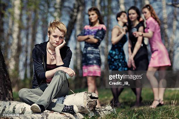 group of girls discussing the other girl - bullying adults stock pictures, royalty-free photos & images