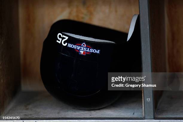 Detail of the batting helmet worn by Mark Teixeira of the New York Yankees is seen in the dugout during warm ups against the Detroit Tigers during...