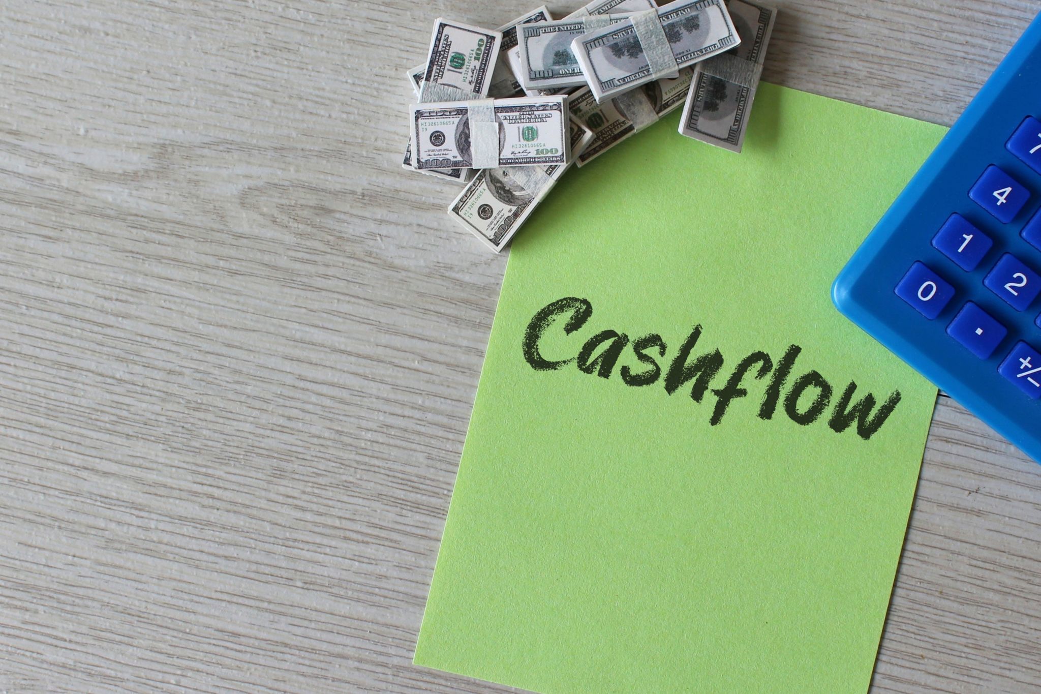 Money, calculator and text CASHFLOW. Money, calculator and text CASHFLOW.