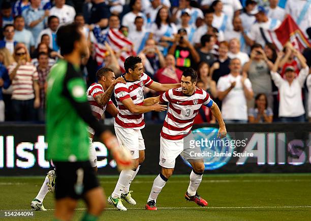 Herculez Gomez, Danny Williams, and Carlos Bocanegra of the USA celebrate after Bocanegra scored a goal during the first half of the World Cup...